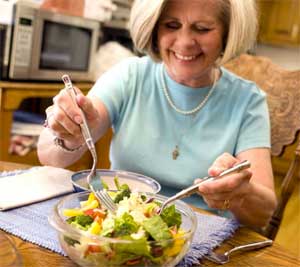 Older Woman Making Salad